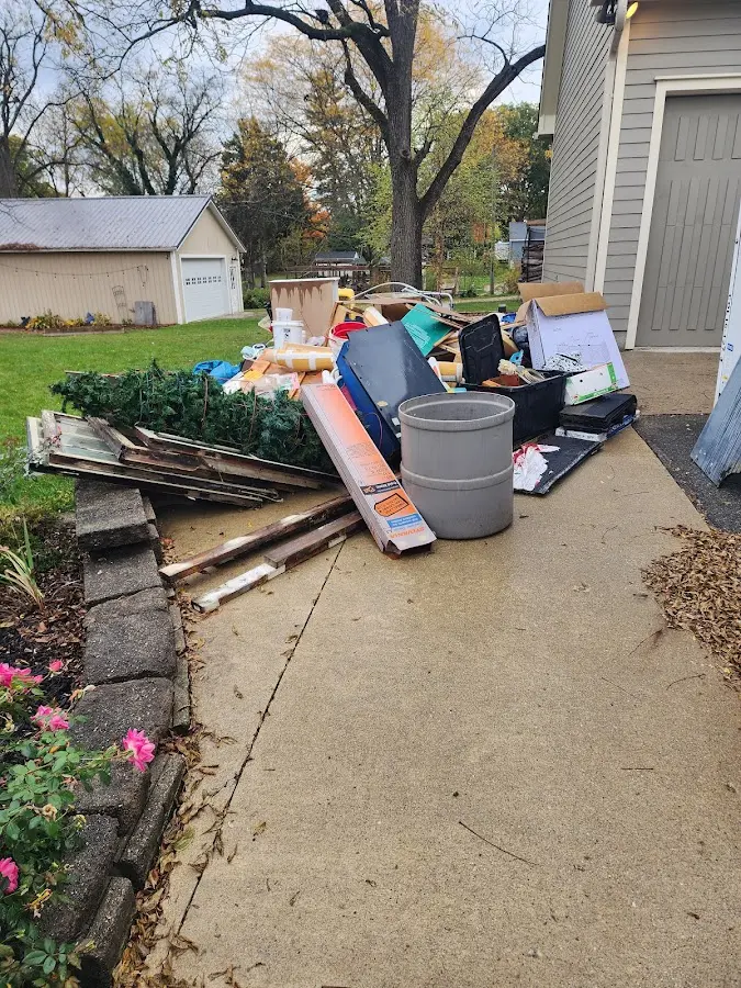 Dumpster being loaded with debris for 30 Yard Dumpster Rental in Franklin Farm